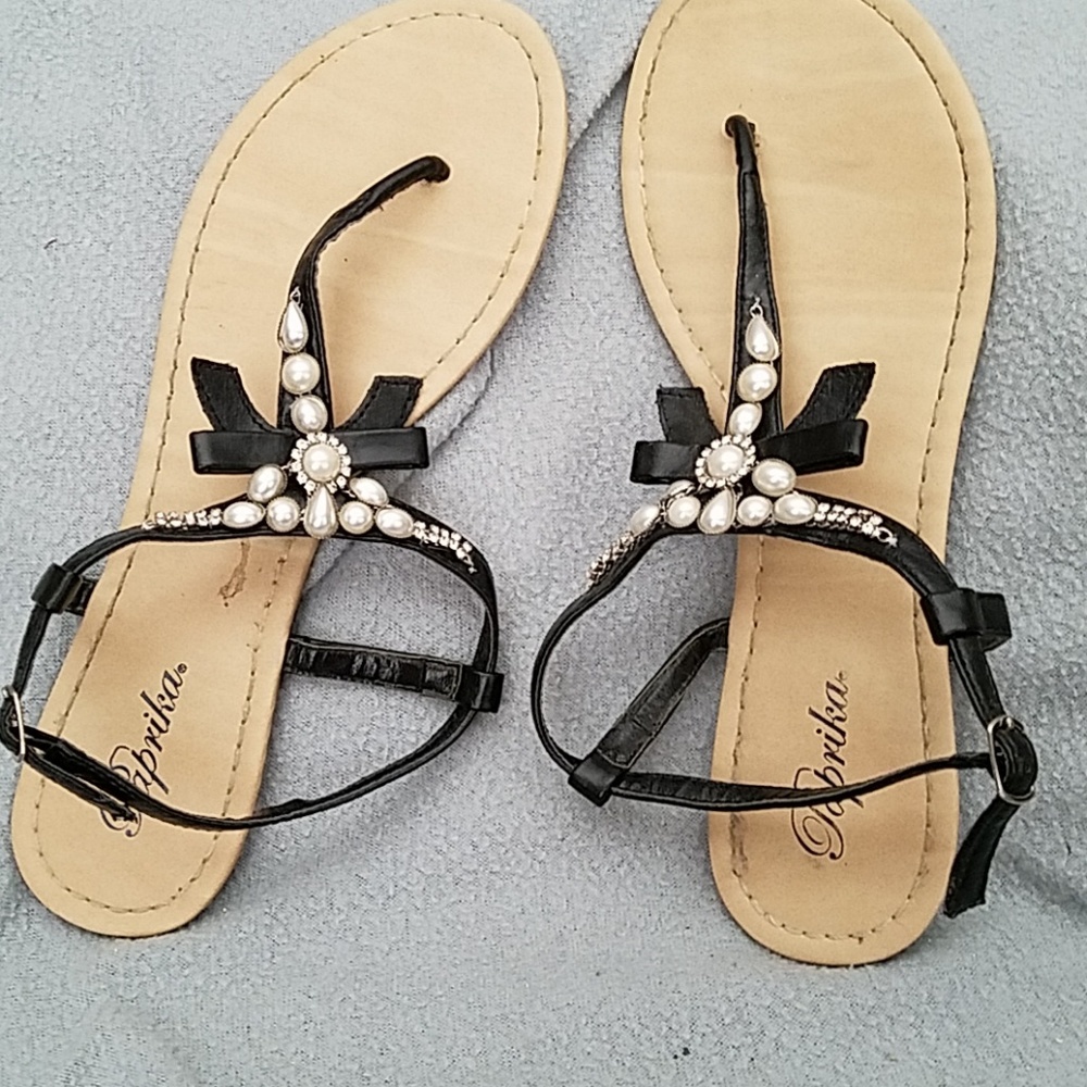 Beaded flat sandals.